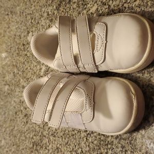 Girl's slip on white tennis shoes